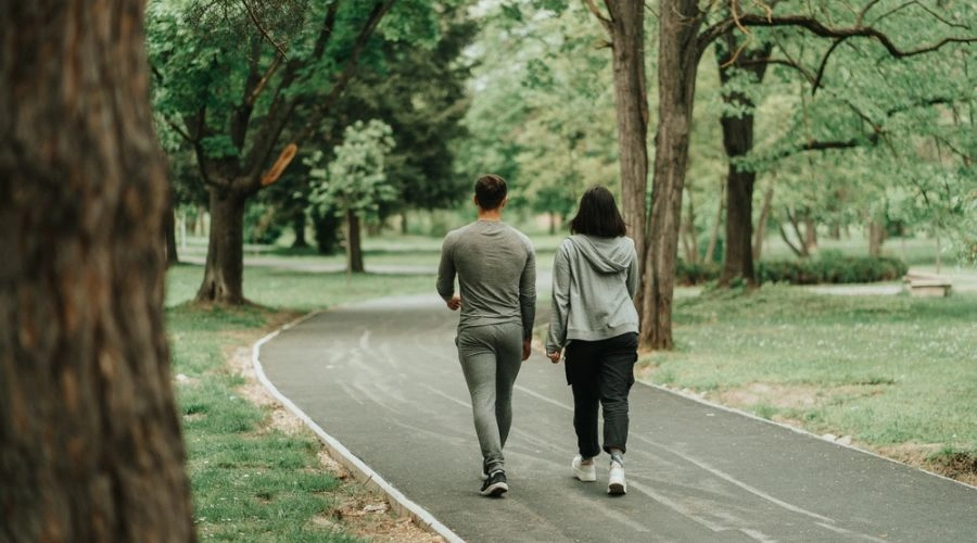 Couple walking down road together displaying Coping Strategies for Managing Stress
