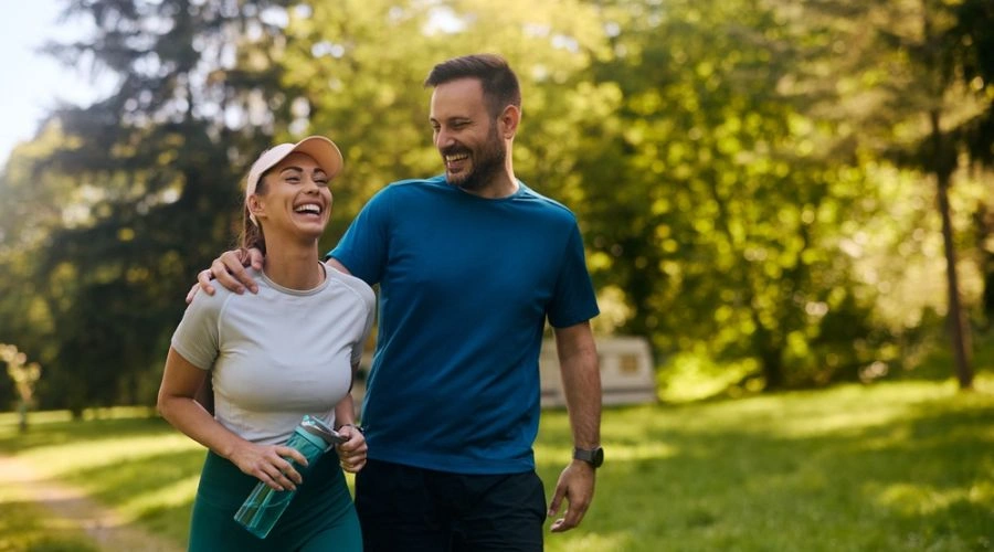 Couple happily walking togetjer displaying Prioritizing Healthy Relationships