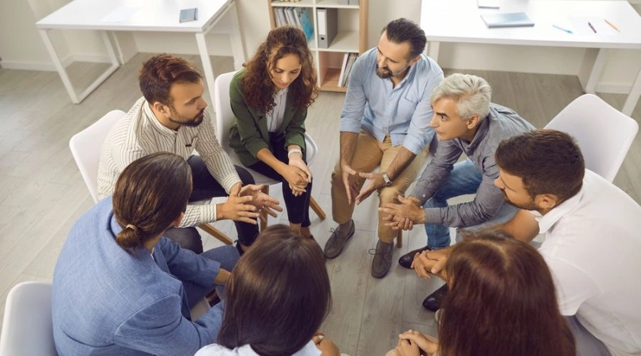 People gathered an an EA meeting -Benefits from Attending EA Meetings