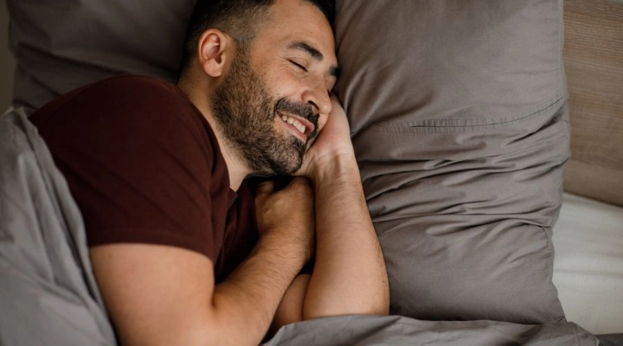 Image of man contently sleeping -Better Sleep Means Mental Clarity