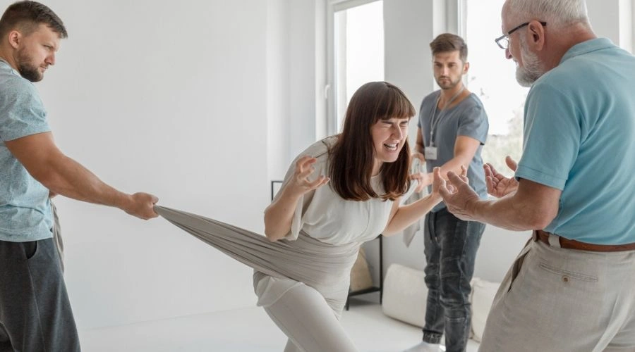 Image of persons engaged in Negative Emotions Release Therapy