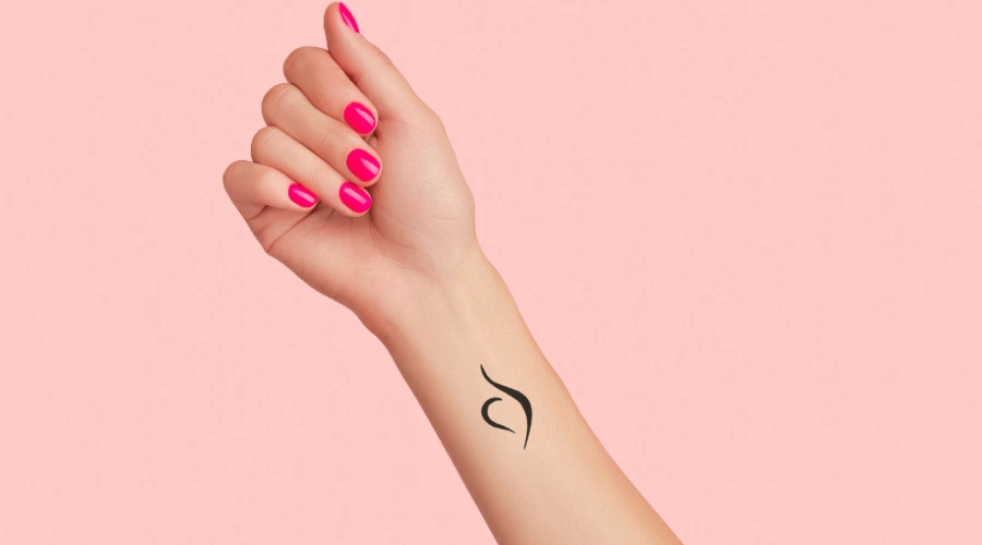 Image of a female arm with tattoo of The National Eating Disorders Association (NEDA) Symbol
