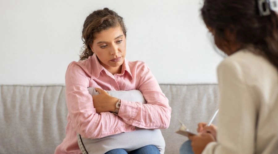 Depressed woman seeking professional help to heal from an abusive relationship