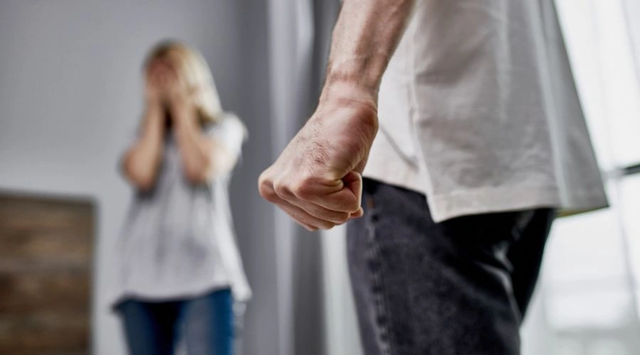 Woman being abused by husband, representing overlooked interpersonal violence and trauma