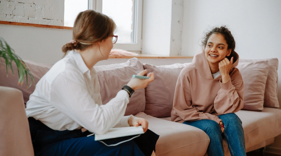 Image of therapist supporting a client during trauma-focused CBT session
