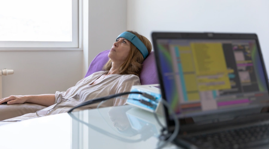 Image of Doctor conducting biofeedback testing on a patient to support BIND recovery