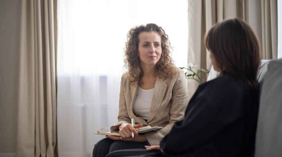 Therapist guiding a client through therapy options for emotional shutdown and mental health support