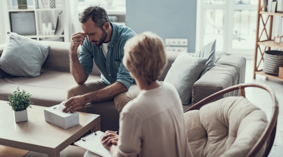 Image of a therapist guiding a client through cognitive behavioral therapy in a calm, supportive setting for avoidant personality disorder treatment