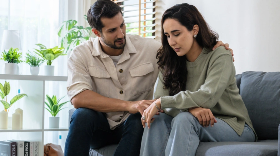 Image of a man trying to console his wife- How to help a depressed spouse - Catalina Behavioral Health