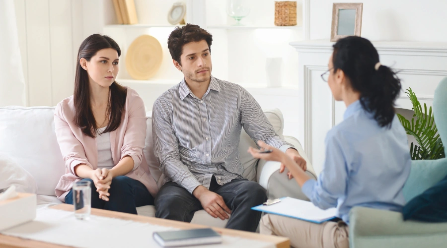 Image of a couple meeting with a licensed therapist to explore professional treatment